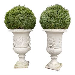 Large pair campana shaped cast iron urns