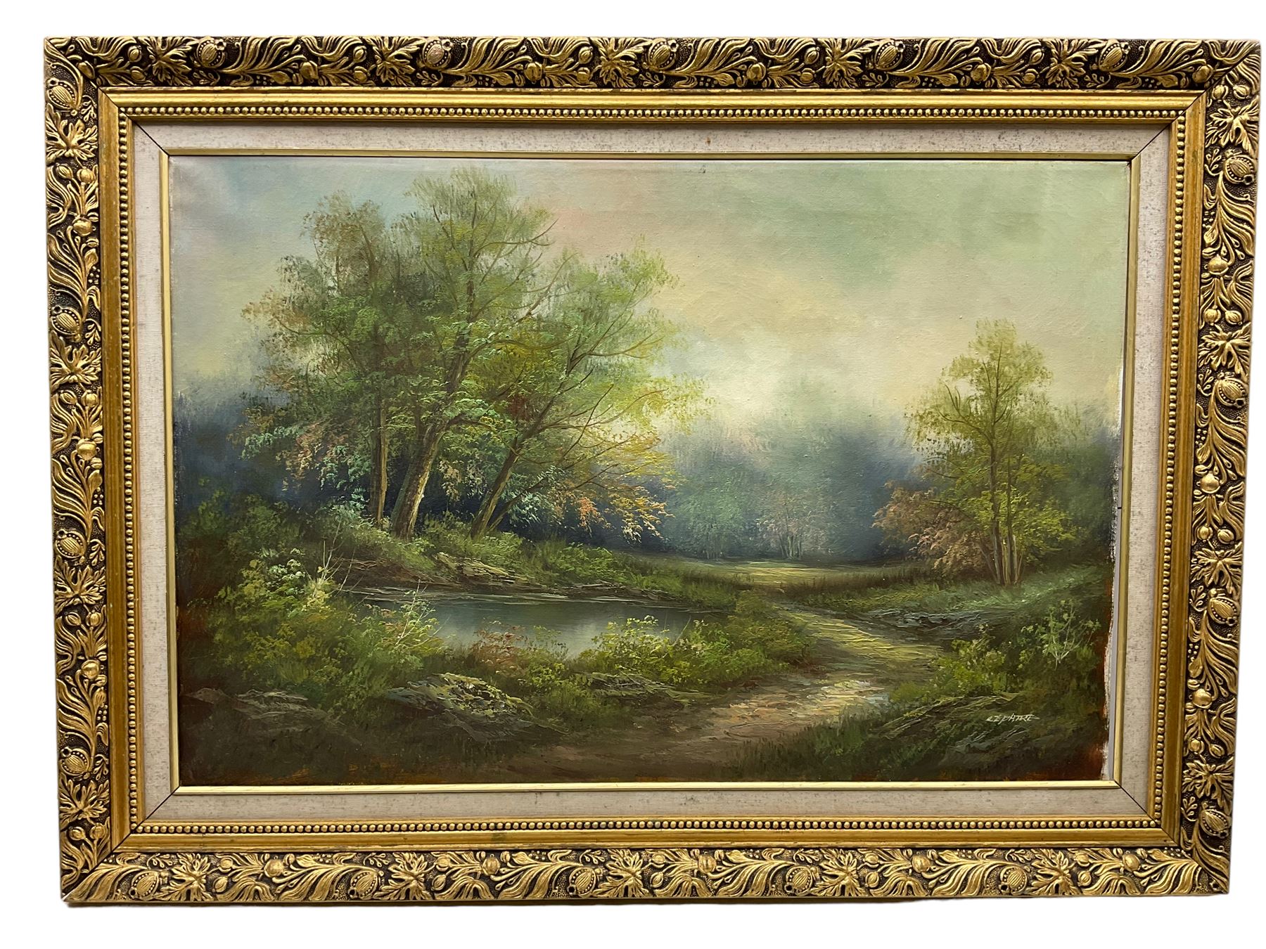 AJ Curry (English Naive School 20th century): Village Scene with Haycart and Figures, oil on canvas signed 50cm x 75cm; Continental School (20th century): Woodland Pond Landscape, oil on canvas indistinctly signed 50cm x 75cm (2)