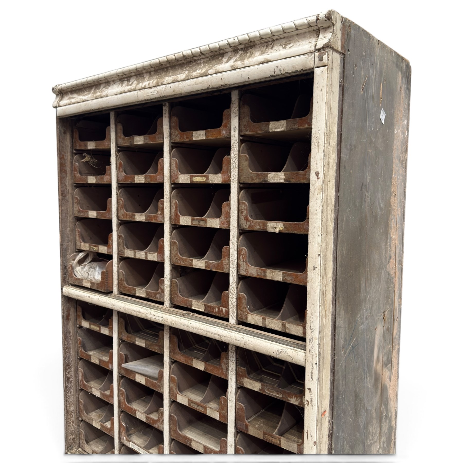 F Pollard & Co - late 19th century rustic haberdashery shop cabinet, fitted with an assortment of forty sliding trays, with drawers fitted to base, in antique white-painted finish