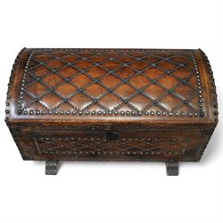 Studded leather dome top trunk, the hinged lid and front decorated with cross pattern in studs, on sledge feet 