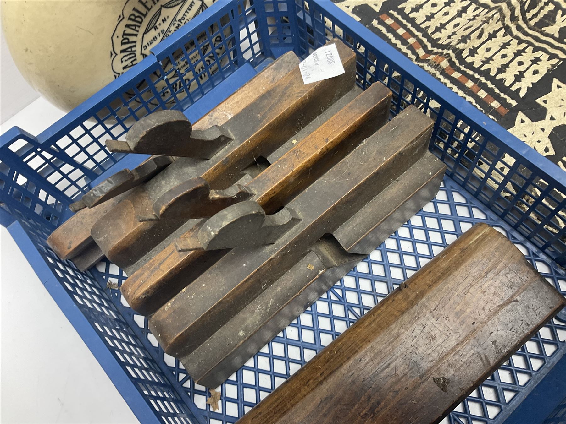 The Adaptable Hot Water Bottle & Bed Warmer made at Old Fulham Pottery, together with six vintage woodworking planes