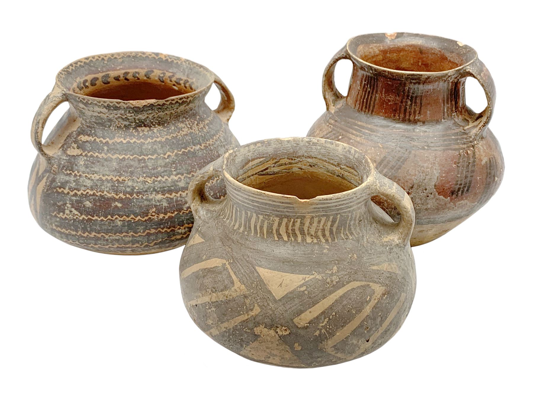 Three Chinese Neolithic pottery vessels, each with twin loop handles to the shoulder and painted geometric banded decoration to the body, all bearing labels for Eskenazi London, tallest H14cm