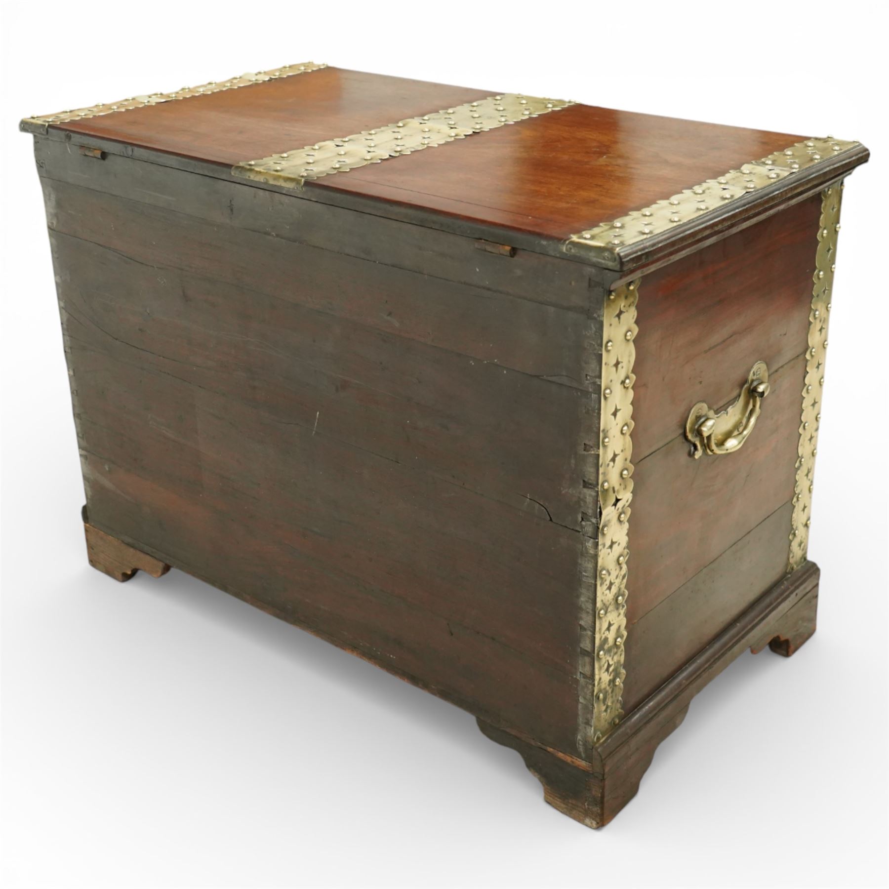 Georgian mahogany brass bound plate chest, the rectangular hinged top mounted with pierced and studded brass straps, fitted with pierced brass escutcheon and large brass handles to the side, lower moulded edge on bracket feet