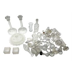 Group of 19th century and later clear glass decanter stoppers to include examples with cut decoration, together with pair of clear glass candlesticks, dishes etc
