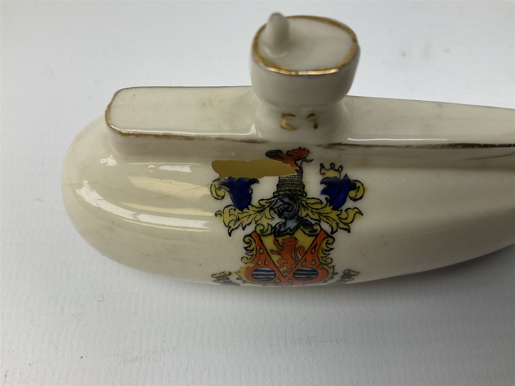 Three pieces of crested ware, comprising grenade detailed 'The Mills Hand Grenade' with Filey Crest, marked beneath Grafton China, a cannon with crest banner detailed 'Sterlini Oppidvm', marked beneath W H Goss, and a submarine with Tunbridge Wells crest, marked beneath Arcadian China 