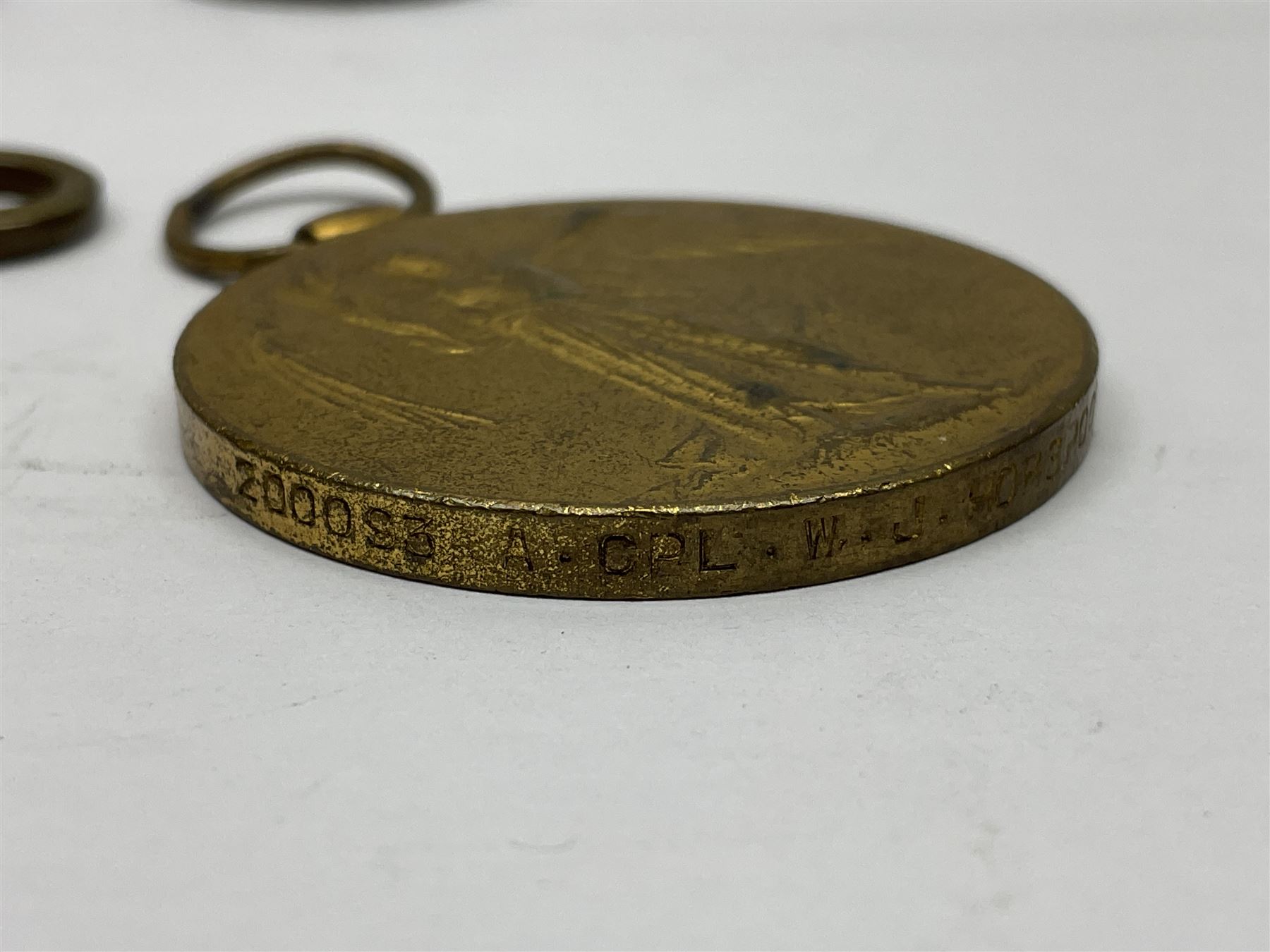 WW1 group of three medals comprising 1914-15 Star awarded to L-Cpl. W.J. Horspool R.War.R., British War Medal and Victory Medal awarded to A. Cpl. W.J. Horspool R.War.R.; WW1 British War Medal awarded to 3-8755 W.O.Cl.2. S. Paterson North'd Fus.; and hallmarked silver and enamel Northumberland Football Association Junior Cup Runners Up fob 1921-22 on silver chain (5)