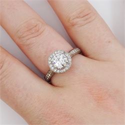Platinum round brilliant cut diamond cluster ring, the principal diamond of approx 1.05 carat, with diamond surround and shoulders, London 2009, total diamond weight approx 1.65 carat