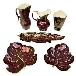 Crown Devon red lustre jug decorated with Galleon, another taller Crown Devon jug, Carlton Ware 'Rouge Royale' leaf dishes and a Carlton Ware vase