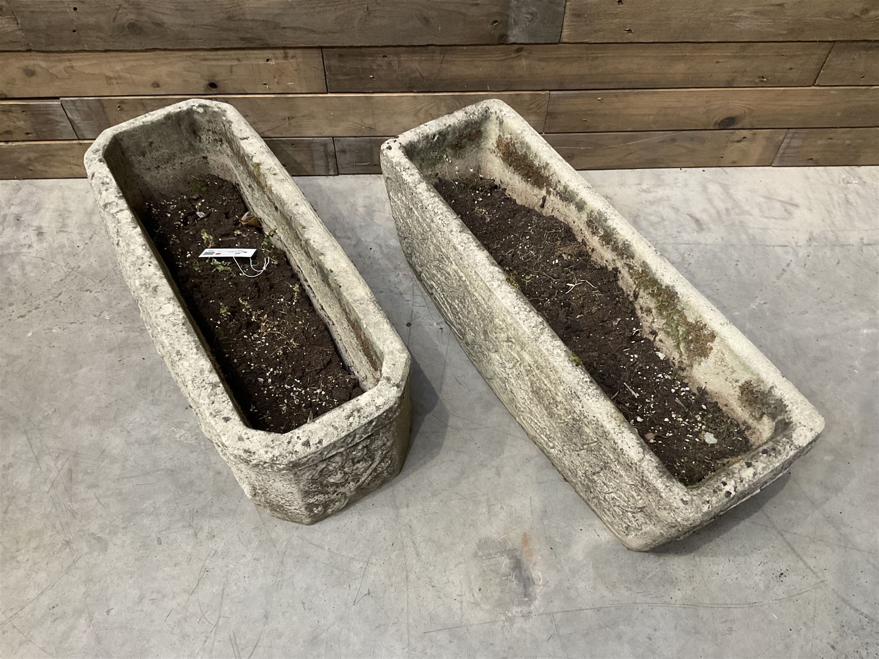 Ornate cast stone rectangular garden planter, lion mask and swag detail, and s similar planter (2)