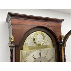 Early 19th century mahogany longcase clock, projecting cornice over a raised satinwood inlaid frieze, stepped arch glazed door flanked by two twist turned columns with cast gilt metal pineapple finials, the brass and silvered dial with Roman and Arabic chapter ring with scroll engraved decoration, subsidiary seconds and date dials, circular name plate signed 'Alex Kirkwood, Paisley', eight day movement striking the hours on bell, figured moulded trunk door with shaped top enclosed by two twist turned quarter columns, plain base, on turned feet