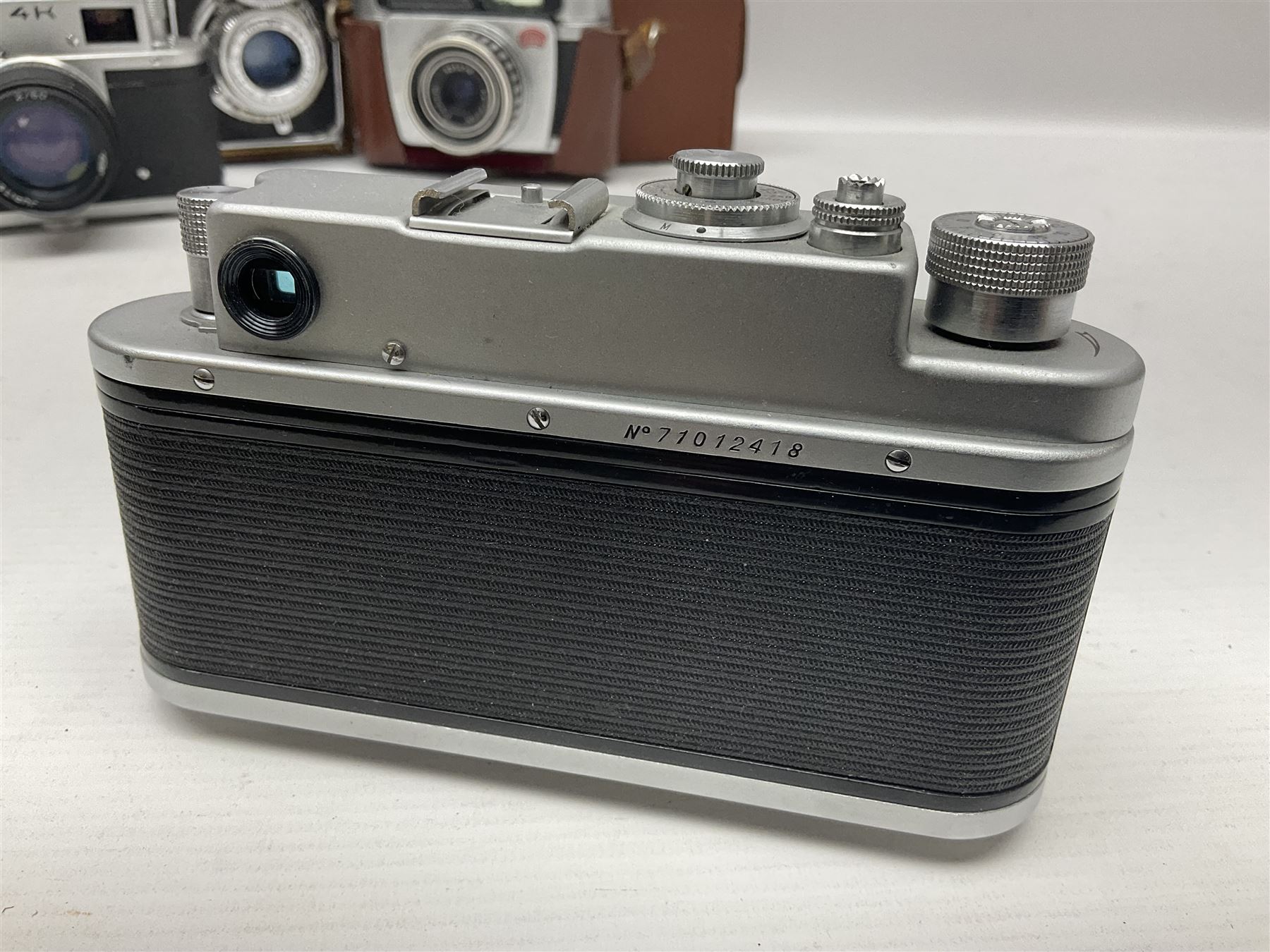 Zorki-4K camera body, serial no 74334713 with 'Jupiter-8 2/50' lens serial no 7454365, Zorki-4 camera body serial no 71012418 with 'Jupiter-8 2/50' lens serial no 0174594, and three other cameras 