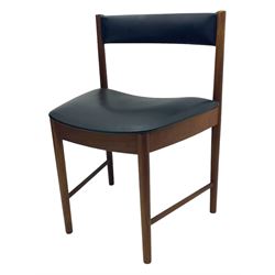 Mid-20th century teak extending dining table, circular top with pull-out extension and concealed leaf extension mechanism, on tapered supports; set of four teak dining chairs with black vinyl padded seats 