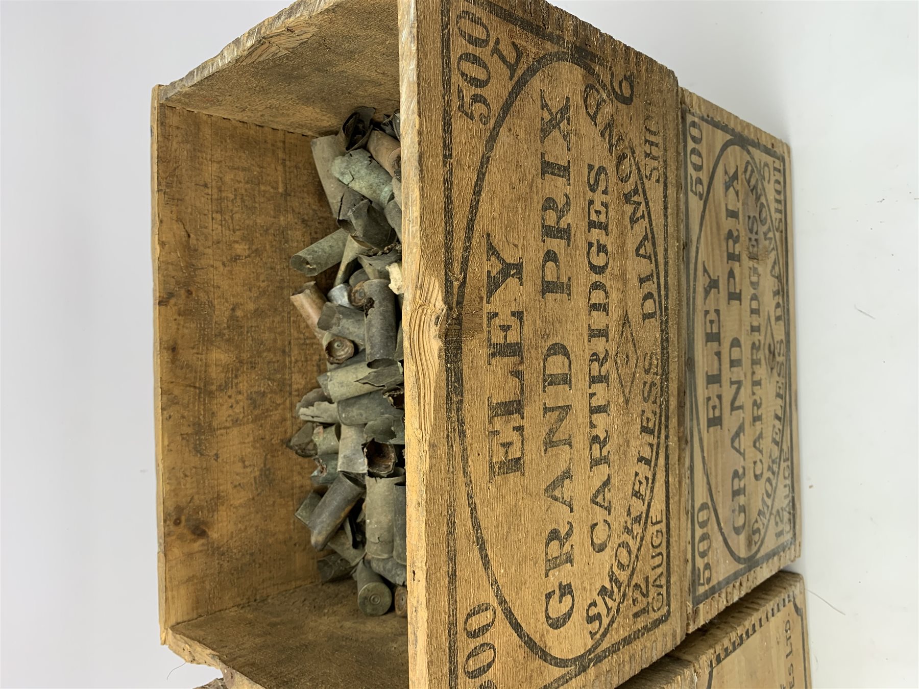 Four vintage Eley cartridge wooden crates each with stencilled decoration 35 x 24 x 23cm; now containing old used metal cartridges and caps etc (4)