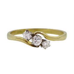Gold three stone diamond crossover ring, stamped 18ct