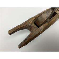 Rare primitive treen lever action nutcracker, probably late 17th/early 18th century, carved in the form of a man, with old collector label to side inscribed 'A Nutcracker XVI Century', H18cm