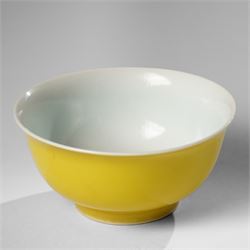 Chinese yellow glazed tea bowl with everted rim, bearing an apocryphal six-character Kangx...