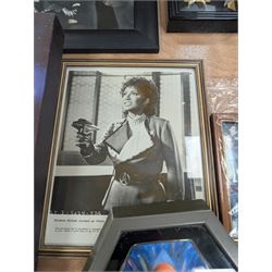 Collection of Star Trek The Next Generation and Deep Space Nine memorabilia, including two limited edition signed Star Trek Deep Space Nine photographs, commemorative porcelain plaque, insignias, Encounter at Farpoint pewter plaque, signed photograph of the Voyager crew, two signed copies of Convergence and a signed War & Madness graphic novel, canvas prints and other signed photos, together with Star Wars Ray Park (Darth Maul) signed photograph, UFO and Buck Rogers memorabilia