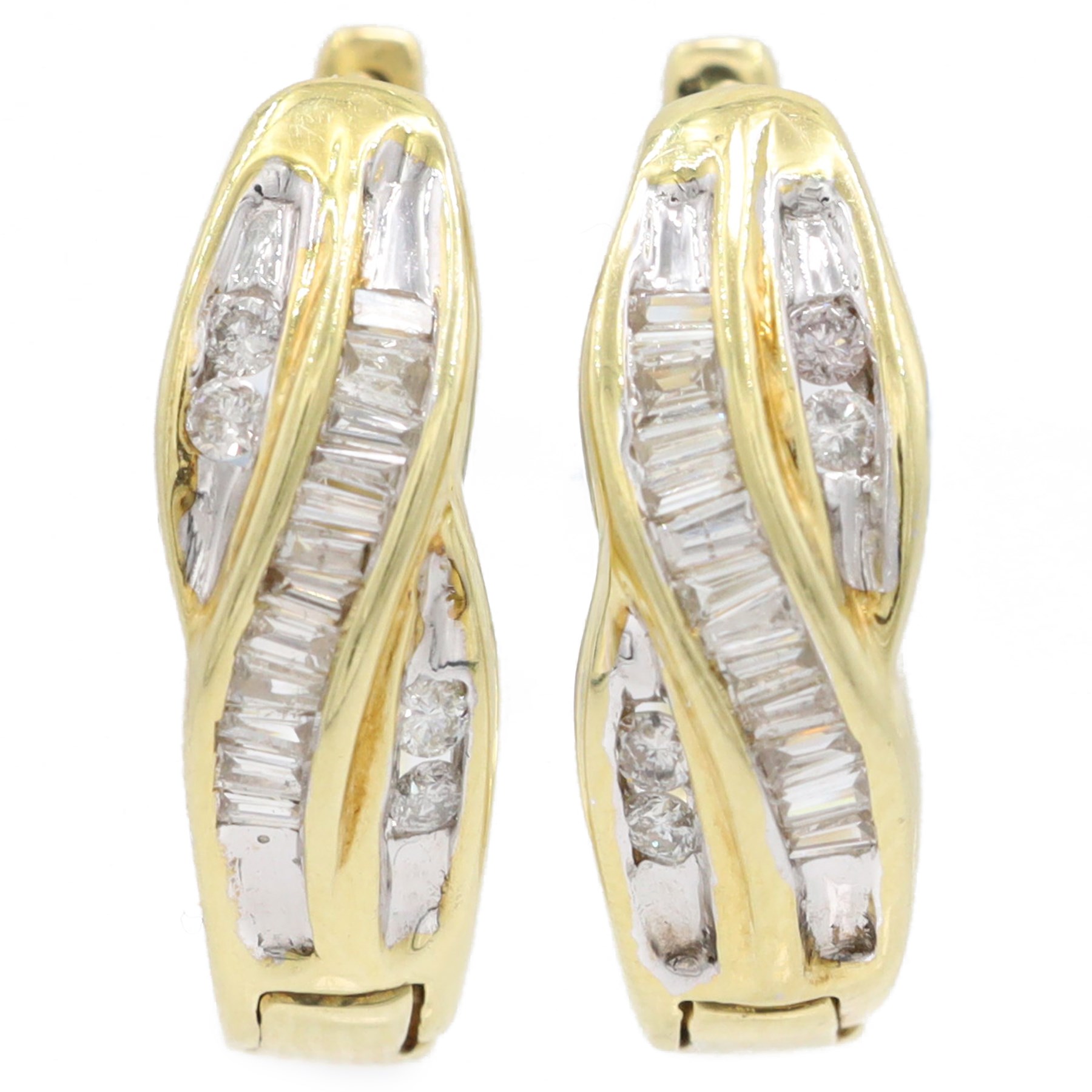 Pair of 14ct gold diamond crossover hoop earrings, each set with tapered baguette and round brilliant cut diamonds, stamped