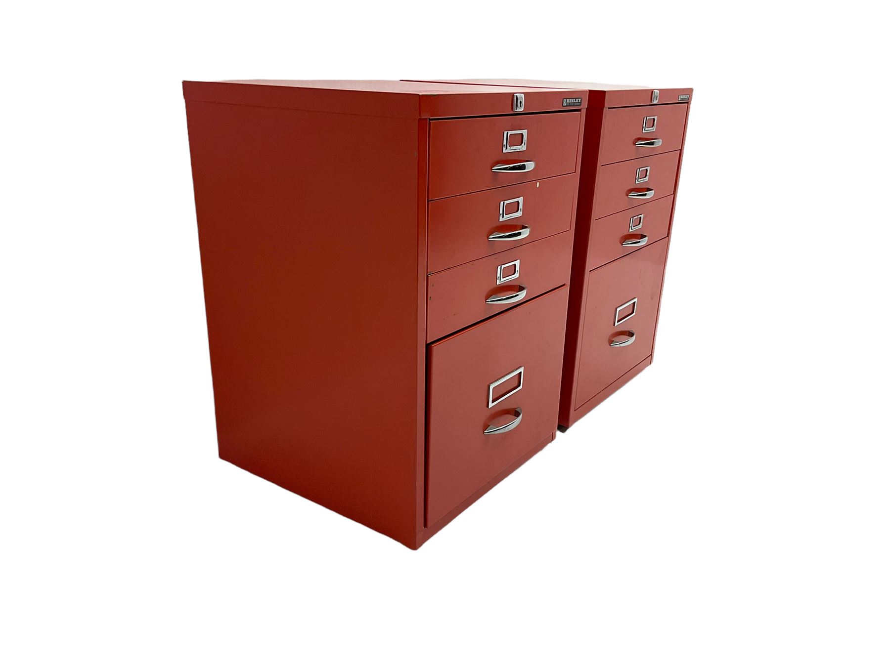 Two red finish 'Bisley' four drawer filing cabinet
