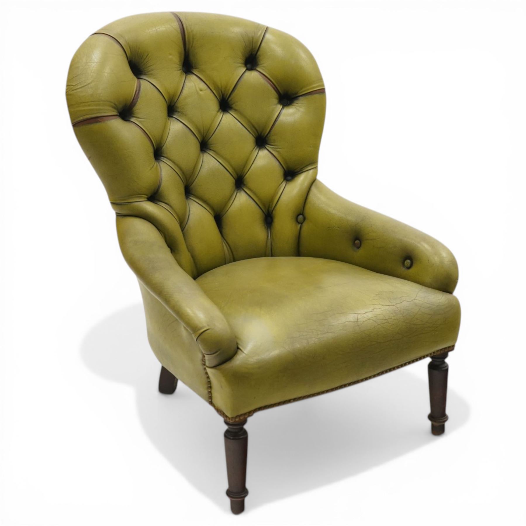 Victorian design tub armchair upholstered in buttoned green leather, on turned front supports