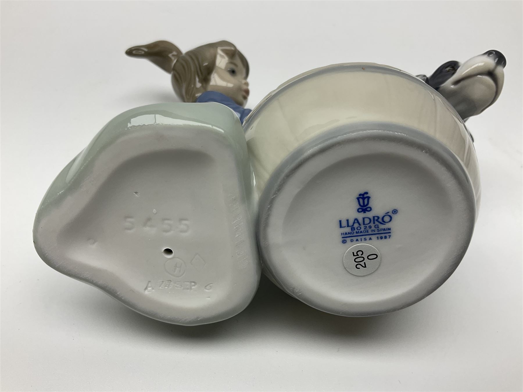 Pair of Lladro figures comprising 'Mis Amigos' model no 5456, and 'Bashful Bather' model no 5455, both with boxes