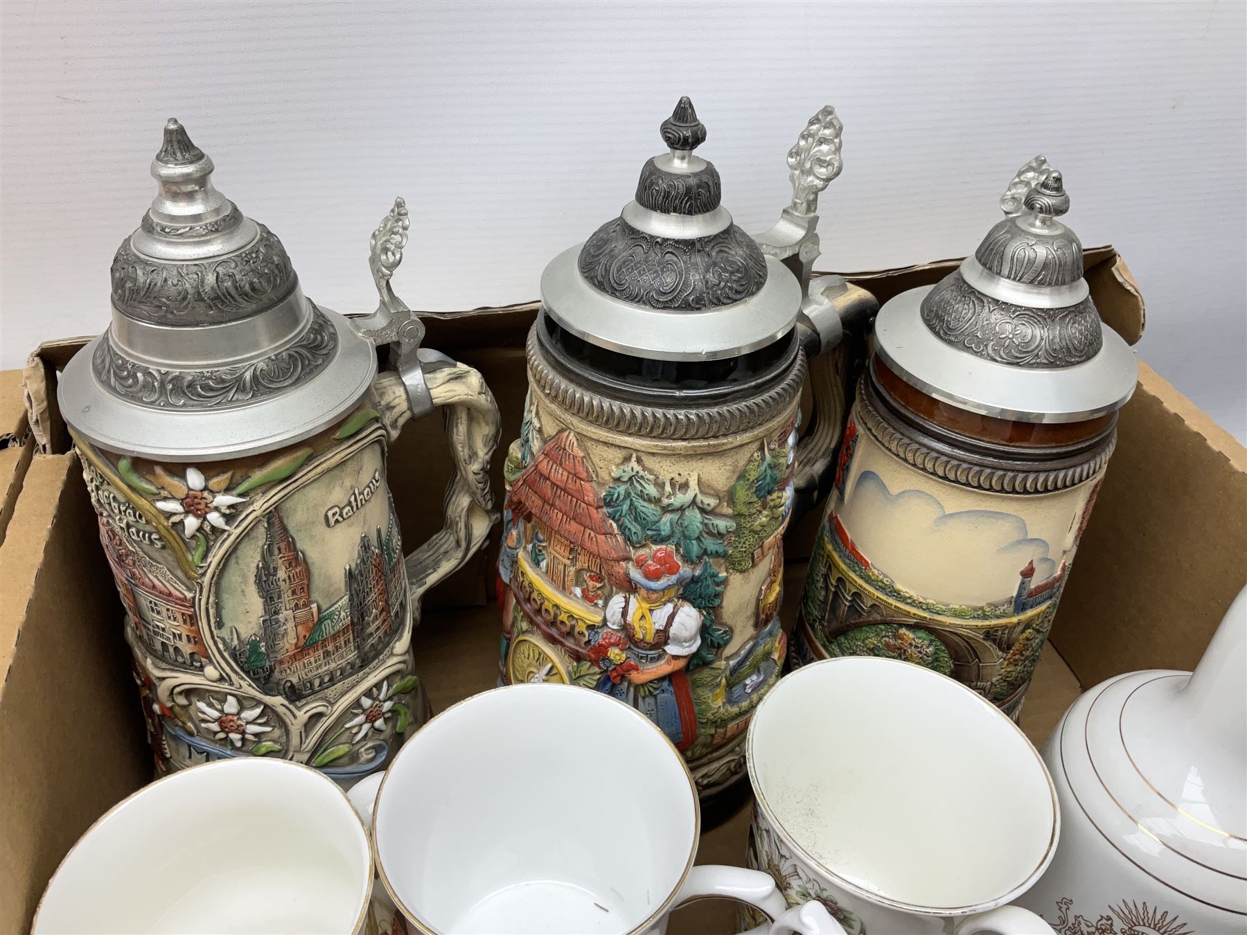 Large collection of glassware to include carnival glass, art glass paperweight, coloured glass, uranium glass, together with three covered steines, ceramic decanters etc, in four boxes 