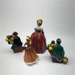 A group of four Royal Doulton figurines, comprising Margery HN1413, The Balloon Main HN1954, The Old Balloon Seller HN1315, and Julia HN2705.