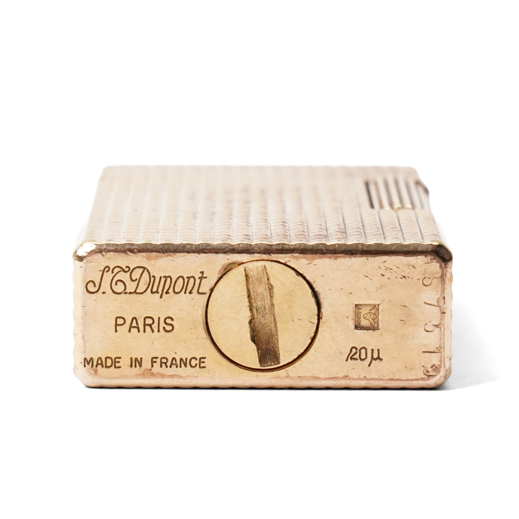 S.T. Dupont - gilt metal pocket lighter, rectangular form with all-over engine-turned diamond decoration and reeded thumbpiece, stamped S.T. Dupont Paris, Made in France, with original fitted box
