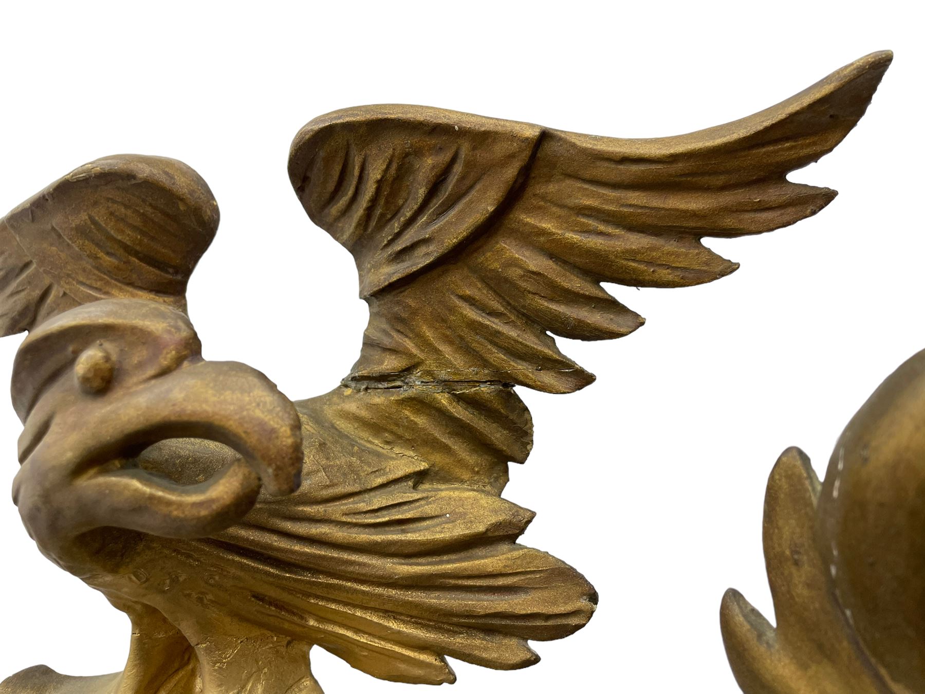 Pair of Regency period giltwood convex wall mirrors, moulded circular frame decorated with spherical mounts surmounted by a carved eagle with spread wings, foliage scroll carved upper and lower brackets, reed moulded and ebonised slip enclosed convex mirror plate 