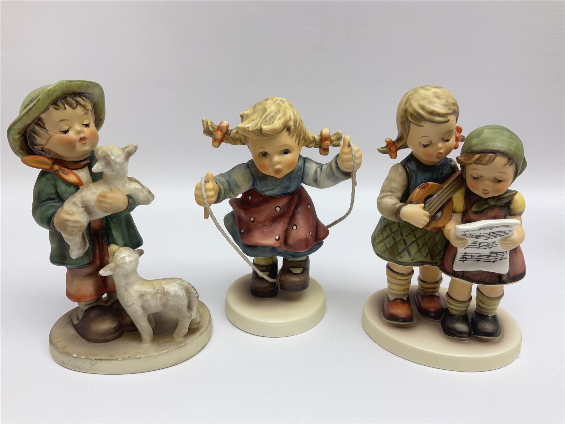Twenty five Hummel figures by Goebel, to include Tuning up, Blessed Event, Book Worm, The Little Architect etc 