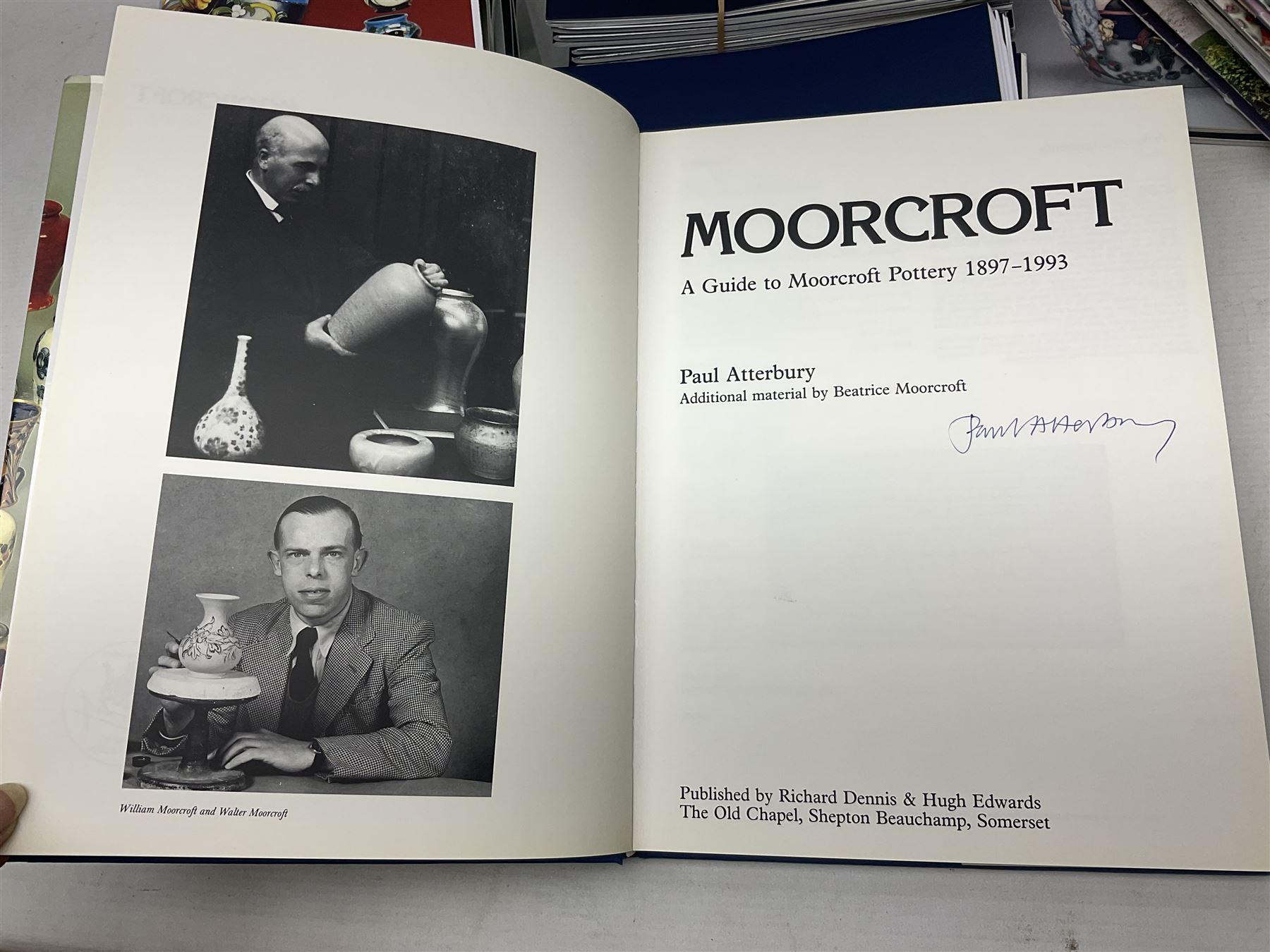 Moorcroft, 1897-1993 revised edition; an illustrated guide to Moorcroft Pottery, a hard back book by Paul Atterbury, together with a quantity of Moorcroft Collector's Club magazines