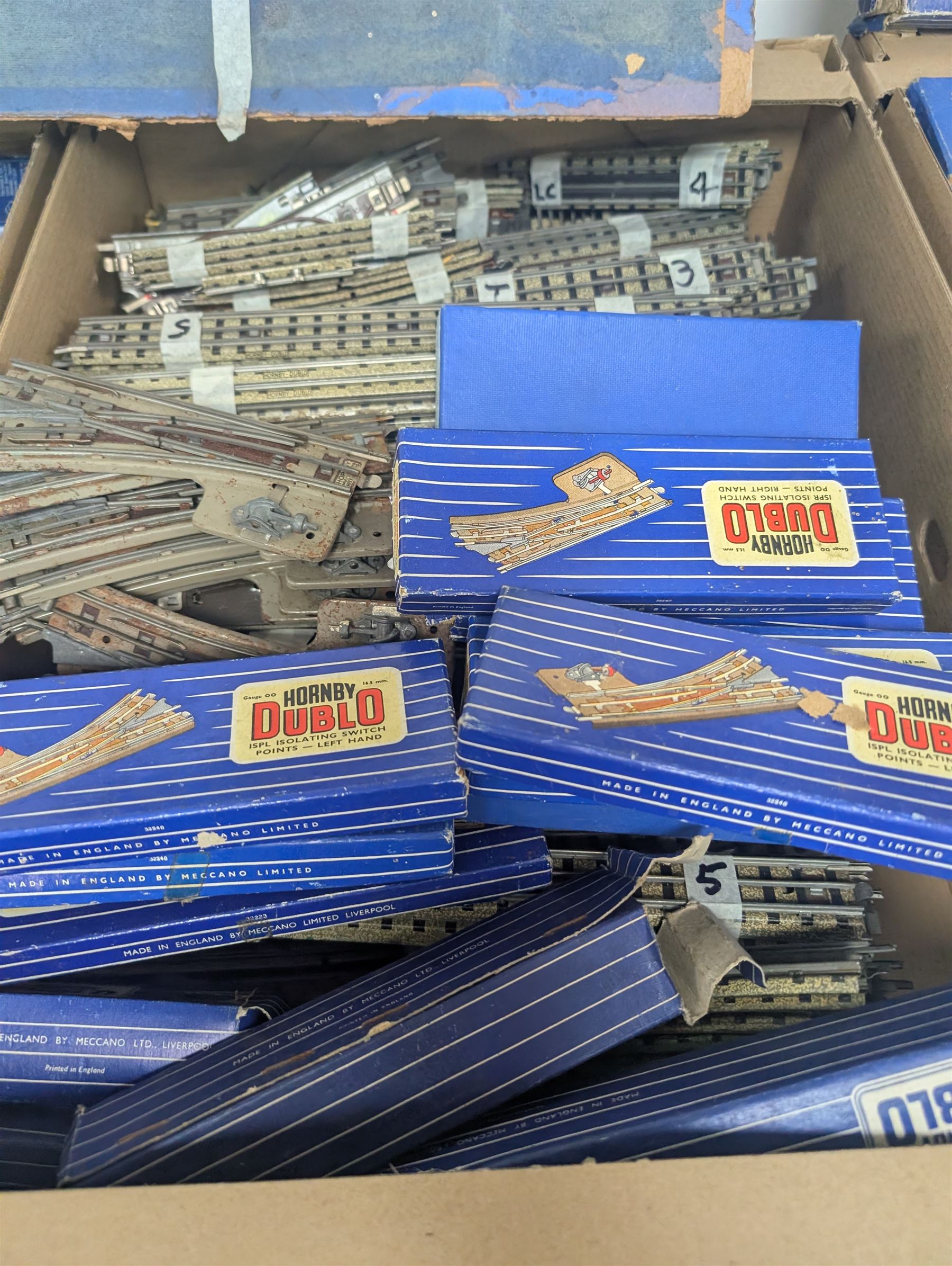 Collection of Hornby Dublo three-rail model railway rolling stock, track and accessories, some boxed