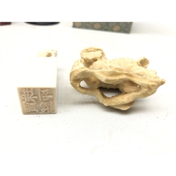  Early 20th century Chinese ivory desk seal with Dragon surmount, two Chinese hardstone desk seals, 19th century ivory figure of Ganesha, 19th century carved ivory Dog of Fo and Chinese pottery figure of a Crane (6) (mao1607)  