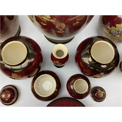 Two Crown Devon Rouge Royale pattern large temple jars with temple dog finial to lid, together with seven other Crown Devon ceramics and two lidded Carlton Ware temple jars in Red Royale, tallest example H47cm (11)