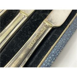 Set of six stag horn handled knives by Cooper Brothers and Sons, together with a set of silver plated dessert knives and forks for six place settings, both within fitted cases