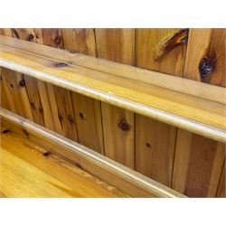 Pine farmhouse dresser with three drawers and three cupboards, and two tier plate rack