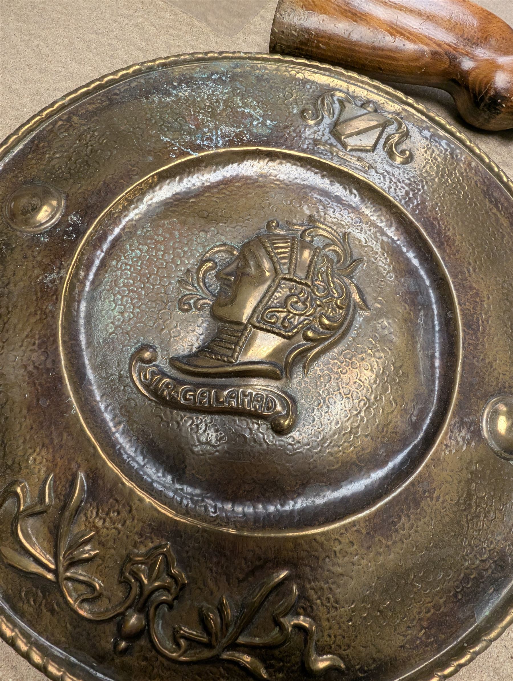 Copper shield and two rapiers, the shield depicting Peter Paul Rubens in relief,  together with a brass Sir Galahad charger, battle axe, mace, replica prop gun, etc