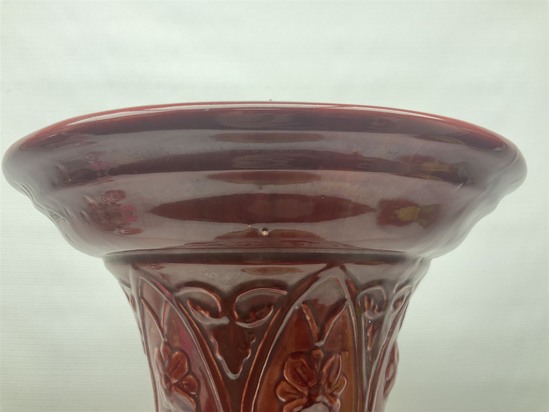 Bretby Jardiniere and stand, with foliate and foliage decoration with a red and yellow ground, impressed mark beneath H94cm
