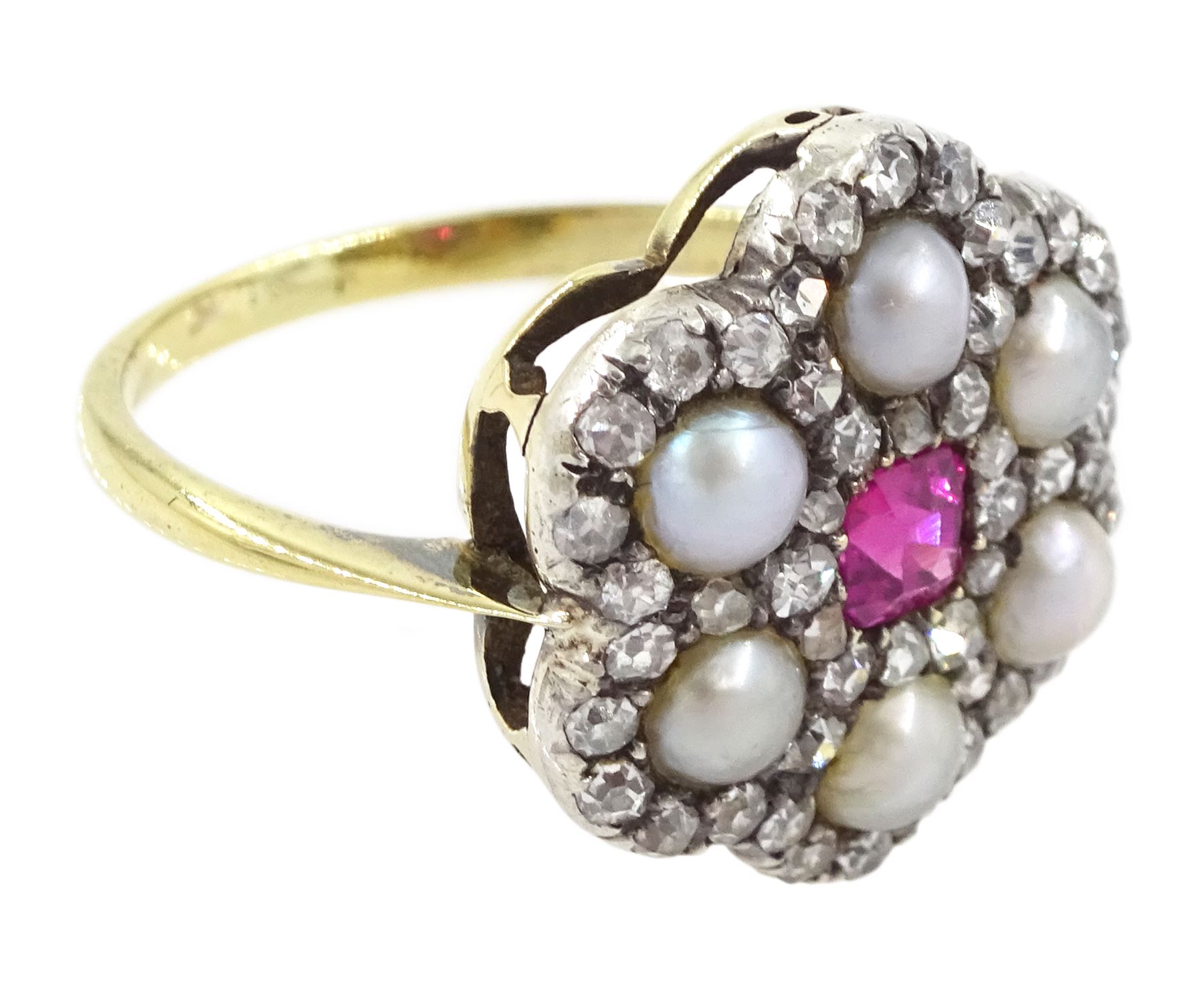 Early 20th century 18ct gold and silver ruby, diamond and pearl flower head cluster ring, single octagonal cut ruby of approx 0.30 carat, with old cut and rose cut diamond and split pearl surround