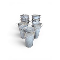 Nine galvanised flower buckets, tapering form with twin handles
