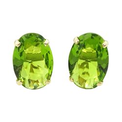 Pair of 9ct gold green stone set stud earrings, stamped