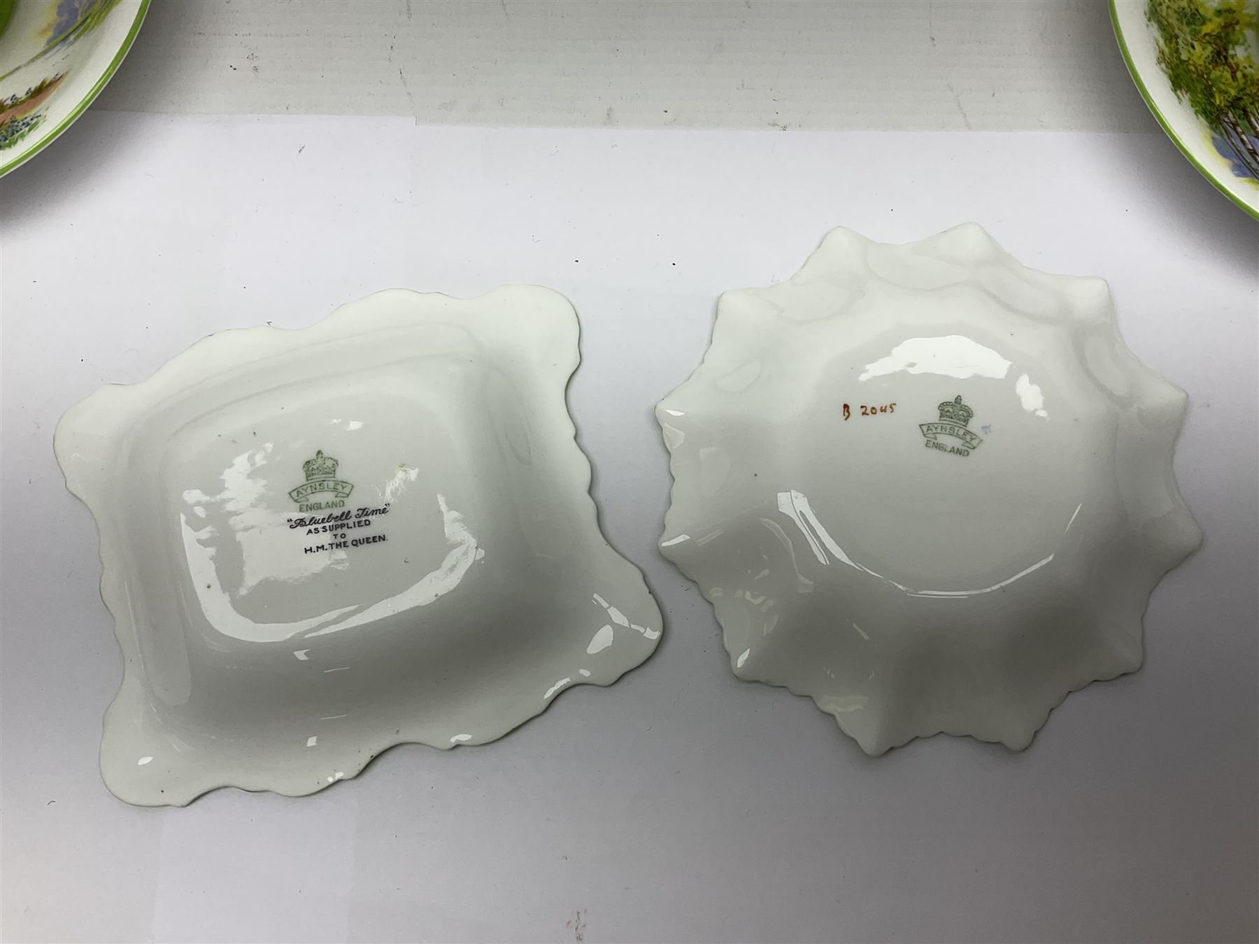 Aynsley Bluebell Time 'As Supplied to the Queen' tea service, comprising hot water jug, six teacups and saucers, milk jug, two cake plates and tow trinket dishes  