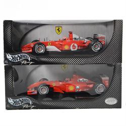 Two Hot Wheels Racing Michael Schumacher Collection 1:18 scale diecast model Formula 1 cars, comprising Ferrari Rednose F2001 and Ferrari F2002, both boxed