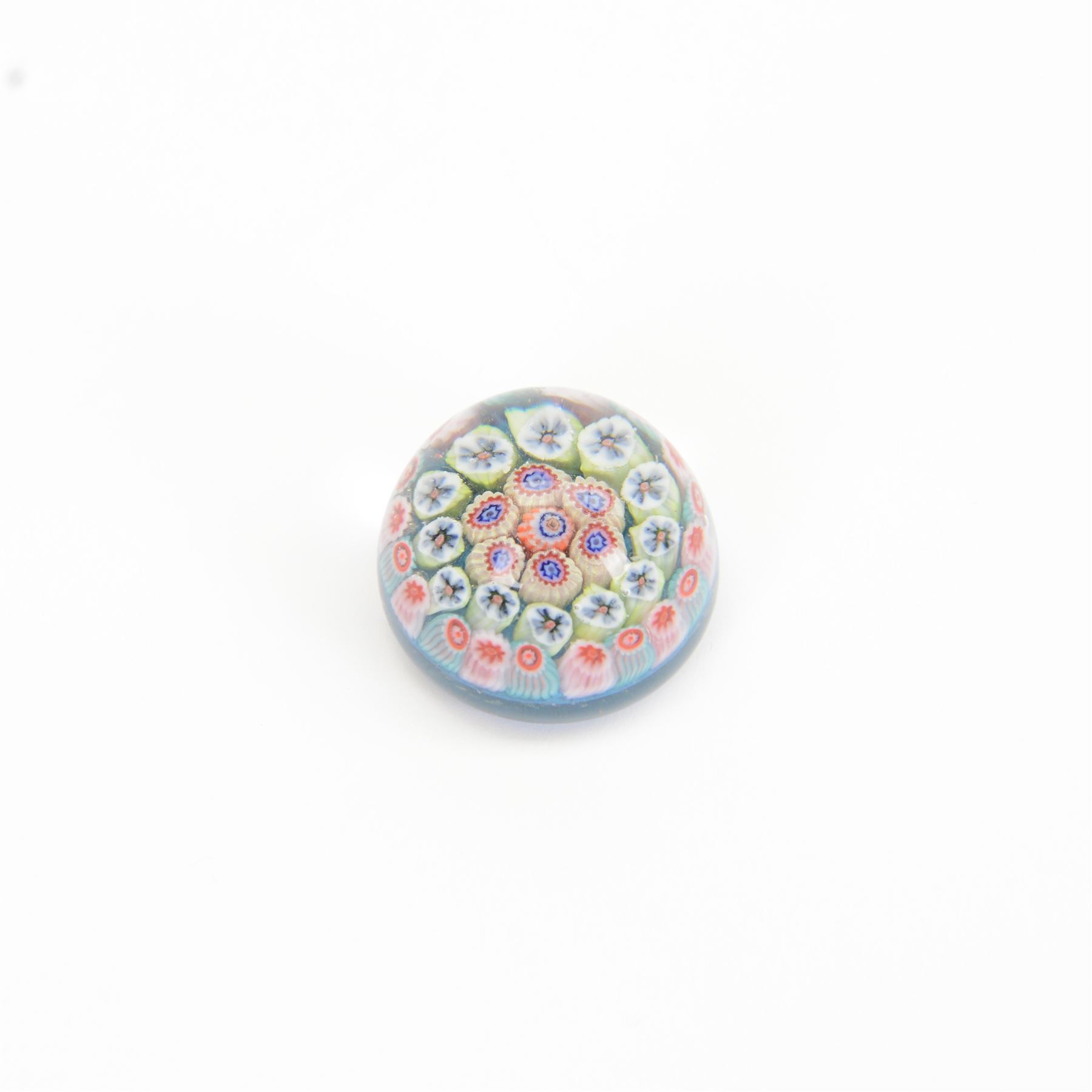 Nine miniature milleifiori paperweights including an example with twisted canes 