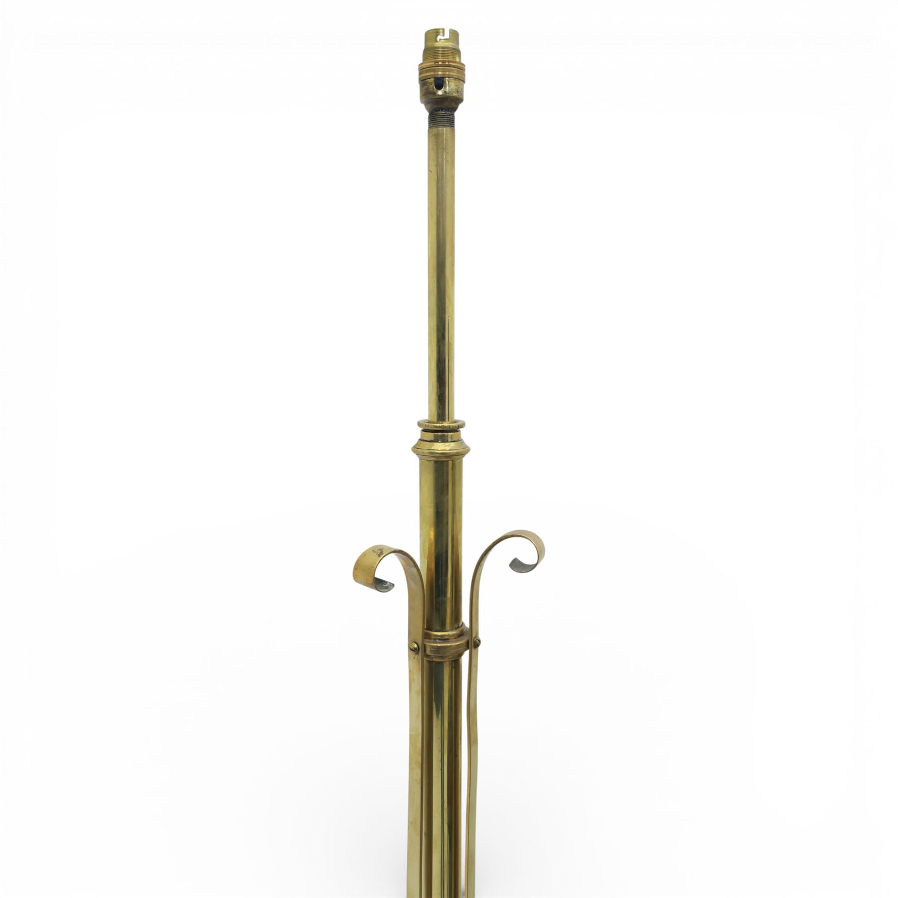 Arts and Crafts copper and brass standard lamp, in the manner of W A S Benson, slender tubular column with adjustable height mechanism, applied copper scroll brackets, circular weighted base with copper struts and stylised feet