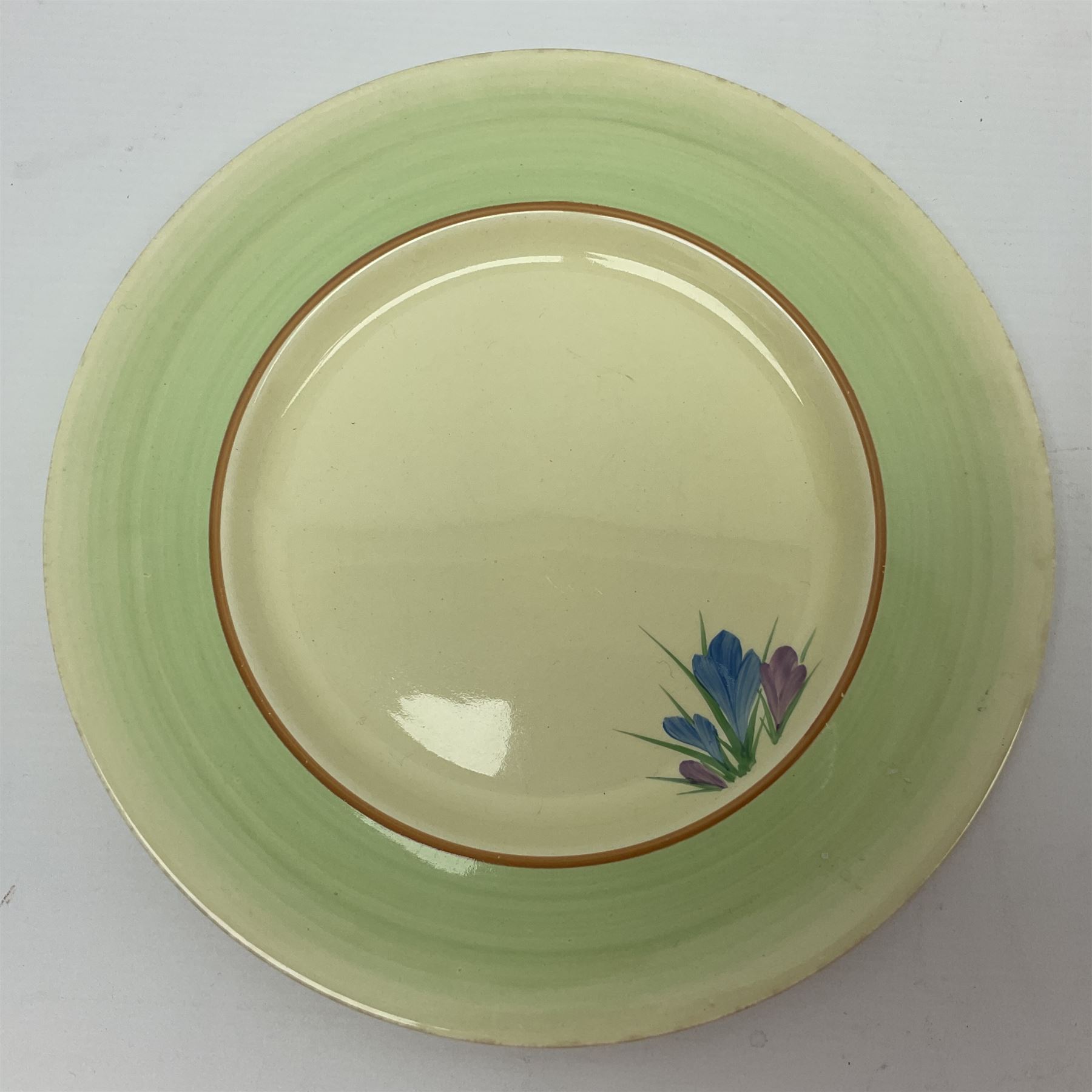 Clarice Cliff trio and plate in Spring Crocus pattern, all with printed mark beneath, plate D25cm 