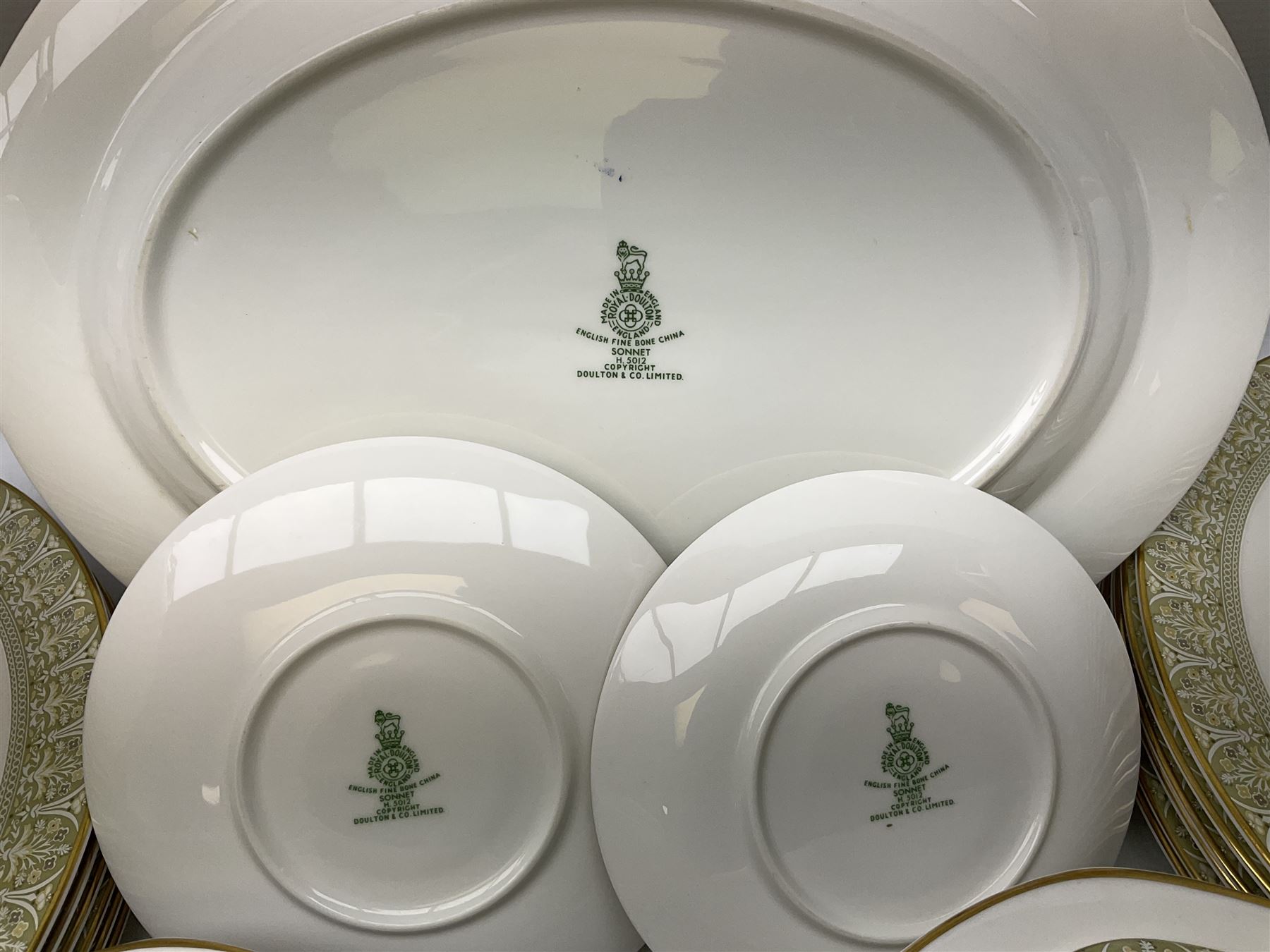 Royal Doulton Sonnet pattern part tea and dinner service, including  twelve dinner plates, twelve bowls, twelve side dishes, two covered tureens, one meat platter, coffee pot, twelve coffee cans and saucers etc (approx 90)