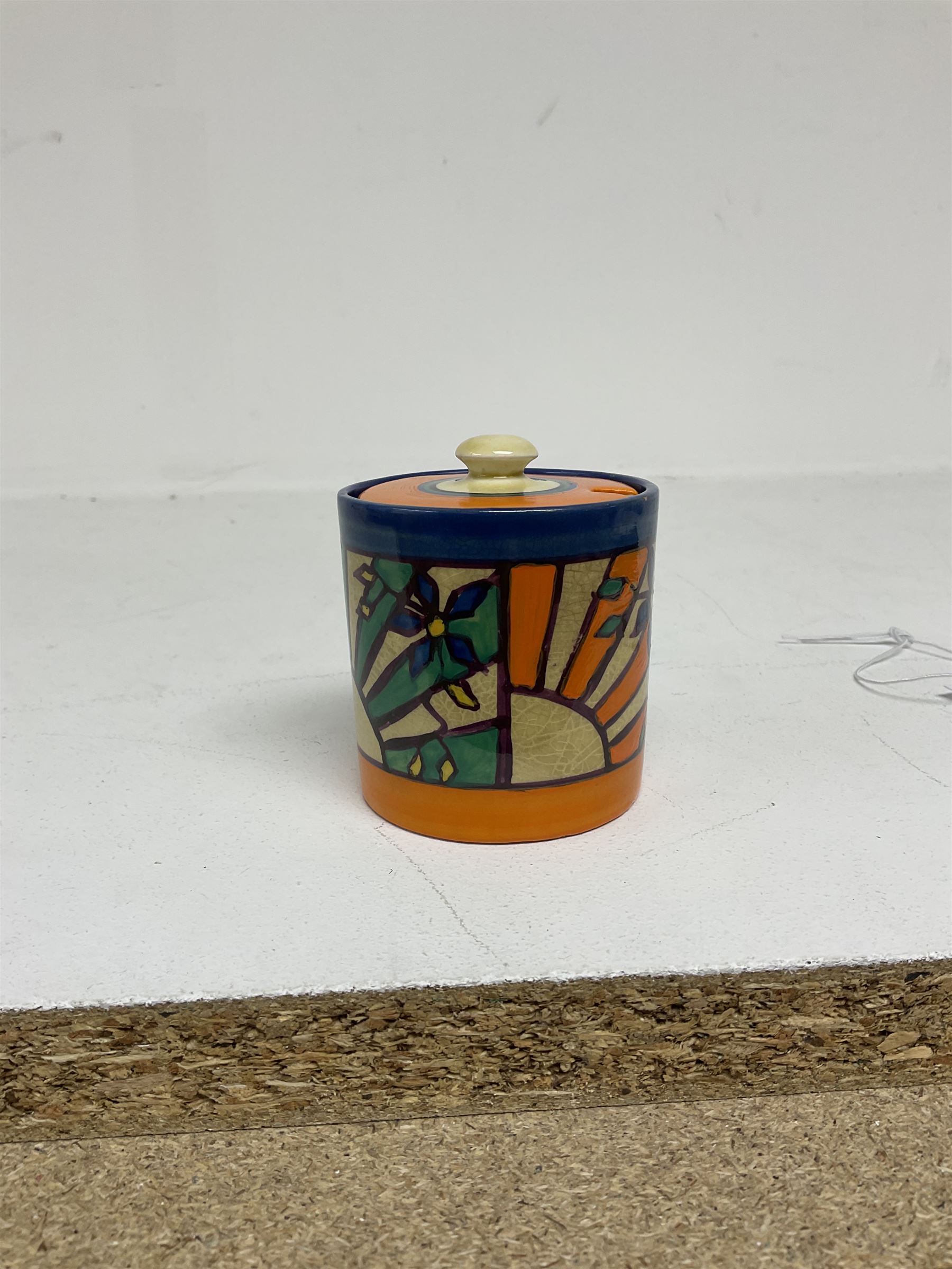 Clarice Cliff Fantasque for Wilkinson Pottery preserve pot, circa 1928, of drum form decorated in Sunray Leaves pattern, H8cm