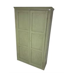 Painted pine cupboard, two panelled doors enclosing four shelves, in laurel green finish