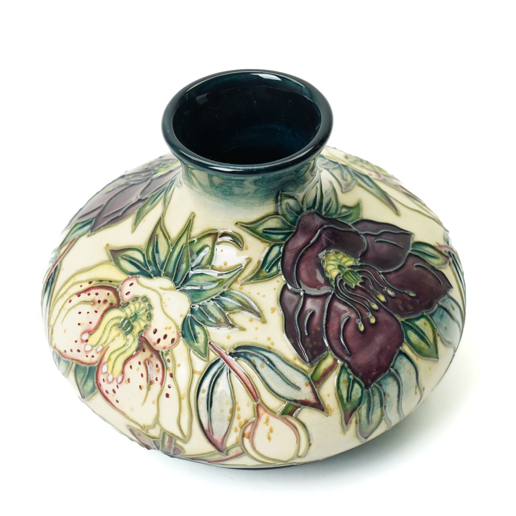 Moorcroft Hellebore pattern vase, of squat baluster form, with impressed and painted marks to base, in original box, H10.5cm 